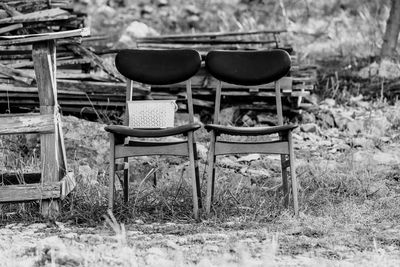 Empty chairs on field