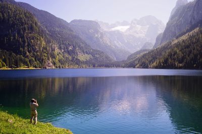 Scenic view of lake with mountains in background