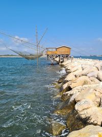 Scenic view of sea against clear blue sky