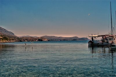 Scenic view of sea against clear sky during sunset