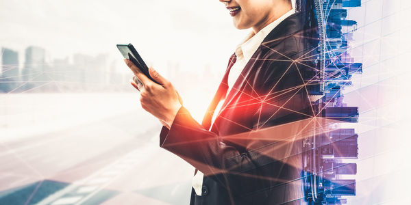 Low angle view of man using mobile phone