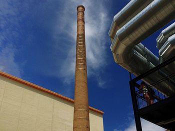 Low angle view of built structure against blue sky