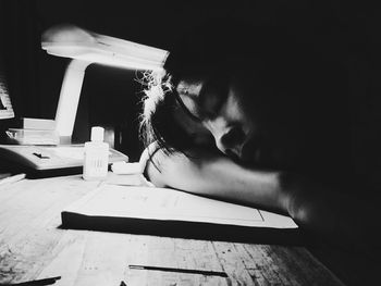 Close-up of man sleeping at table