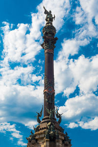 Low angle view of statue against cloudy sky