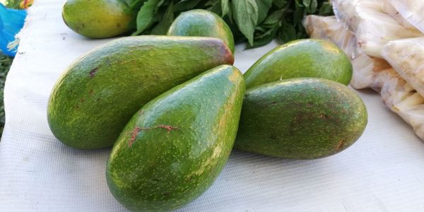 Close-up of green fruits on table