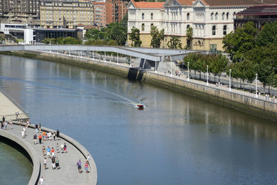 High angle view of bridge over river by buildings in city