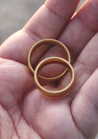 Close-up of couple holding hands