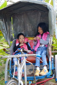 Children sitting in pedicab