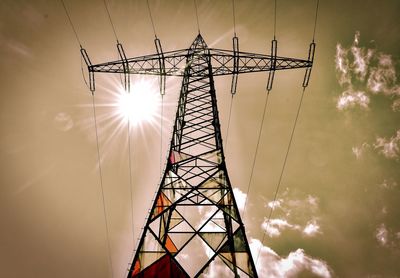 Low angle view of ferris wheel against sky