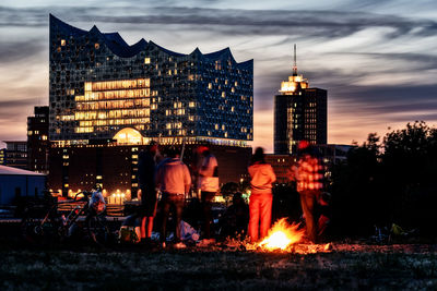 Group of people in illuminated building at night