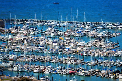 High angle view of sailboats moored at harbor