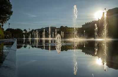 Reflection of illuminated buildings in water