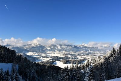 Scenic view of mountains against sky during winter