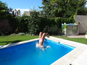 Swimming pool against calm blue sea