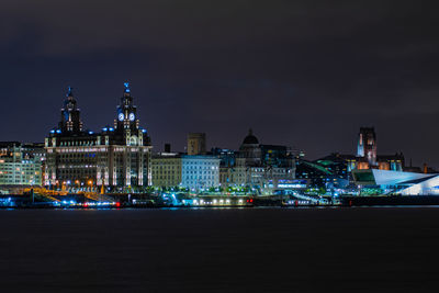 Illuminated buildings in city at night