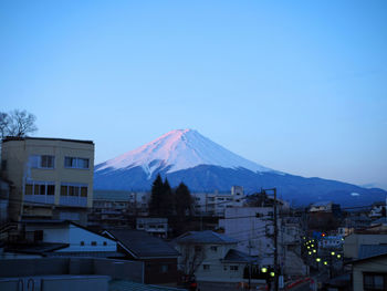 View of a town against blue sky