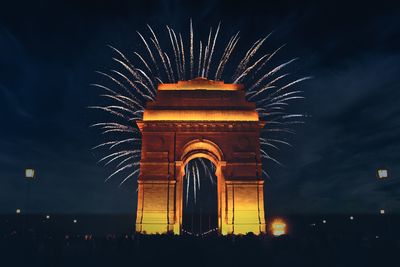 India gate war memorial is silhouetted as fireworks light up the sky above, in new delhi, india