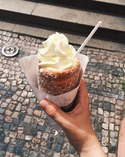 Close-up of hand holding ice cream