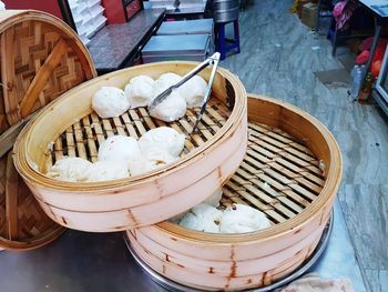 White food with serving tongs in baskets on table