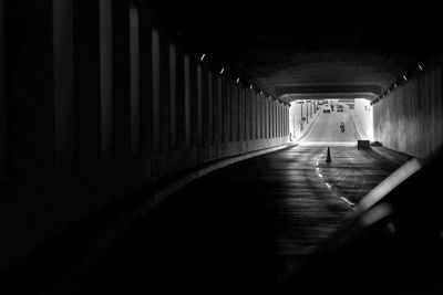 Man in illuminated tunnel