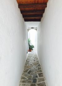 Rear view of man in white corridor