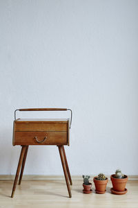 Chair on table against wall at home