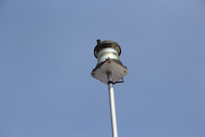 Low angle view of street light against clear blue sky