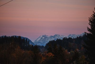 Scenic view of mountains against sky during sunset