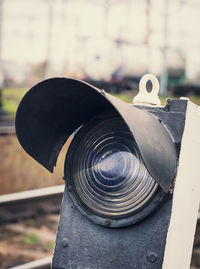 Old broken railway light signal, traffic light with autumn background