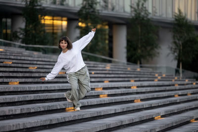 Beautiful hip hop girl dancing on the street