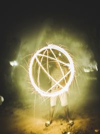 Light painting against sky at night