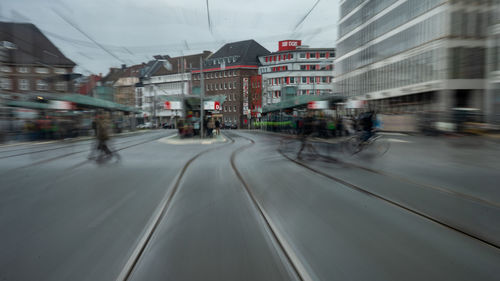 Road amidst buildings in city