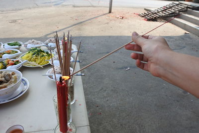 High angle view of person hand on table