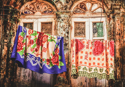 Close-up of clothes drying against building