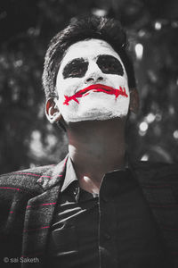 Close-up portrait of man with umbrella