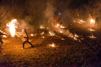 Man with fire crackers at night