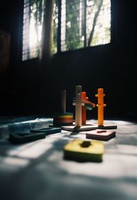 Close-up of toy on table by window