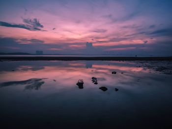 Scenic view of sea against sky at sunset