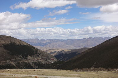 Scenic view of landscape and mountains against sky