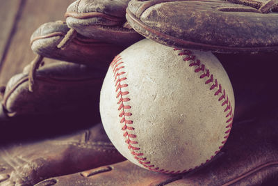 Close-up of baseball equipment on table