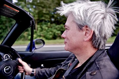 Close-up of man driving car