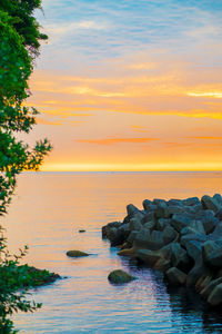 Scenic view of sea against sky during sunset