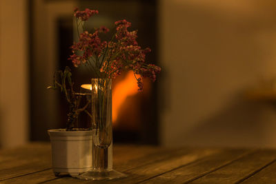 Close-up of flower vase on table at home