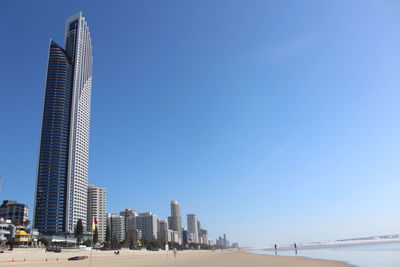 Low angle view of buildings against blue sky