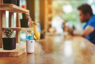 Close-up of wine bottles on table