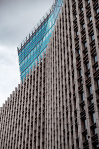 Low angle view of modern building against sky in city