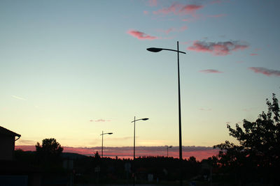 Silhouette trees against sky during sunset