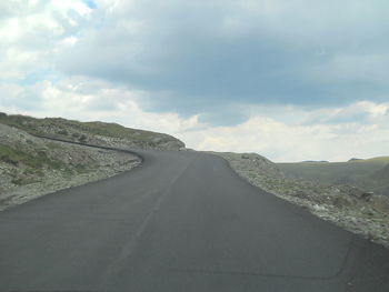 View of road against cloudy sky