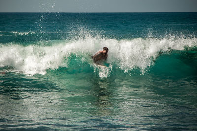 Man surfing in sea