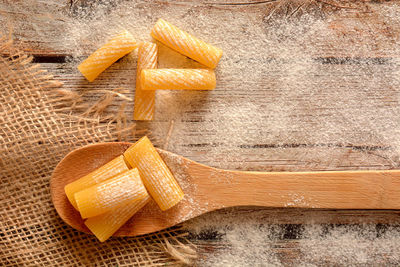 Directly above shot of yellow cake on cutting board